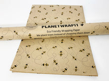 Load image into Gallery viewer, Roll of eco-friendly wrapping paper with bee design and 'Planetwrapit' | branding. | Hadley Green Home