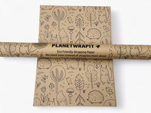 Load image into Gallery viewer, Eco-friendly wrapping paper with illustrations and 'Planetwrapit' branding on a white background |Hadley Green Home