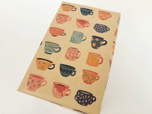 Load image into Gallery viewer, Kraft wrapping paper with colourful coffee cup pattern on a beige background | Planetwrapit | Hadley Green Home