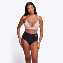 Load image into Gallery viewer, Woman wearing a beige sports bra and black high-waisted wuka period pants on a white background | Hadley Green Home