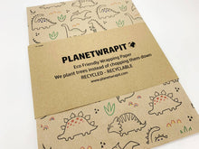 Load image into Gallery viewer, Eco-friendly wrapping paper with dinosaur design and Planetwrapit branding. | Hadley Green Home