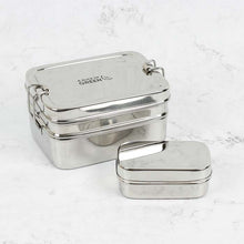 Load image into Gallery viewer, A two-tier rectangle stainless steel lunch box with a mini container, featuring a clip closure and displayed on a marble surface. | Hadley Green Home