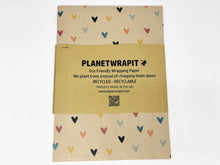 Load image into Gallery viewer, Planetwrapit eco-friendly wrapping paper with heart patterns on a beige background |Hadley Green Home