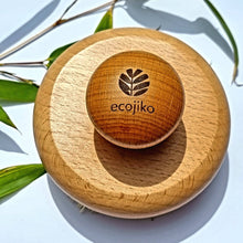 Load image into Gallery viewer, Wooden hairbrush with 'ecojiko' branding on a light background with leaves. | Hadley Green Home