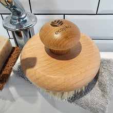 Load image into Gallery viewer, Wooden brush with ecojiko logo on a bathroom counter next to soap and a soap dish. | Hadley Green Home