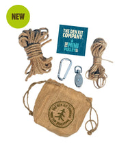 Load image into Gallery viewer, Den Kit Company mini pulley system with rope, carabiner, and packaging on a white background | Haley Green Home
