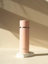 Load image into Gallery viewer, Pink thermos bottle with &#39;Qwatch&#39; branding on a light background | Little Twidlets
