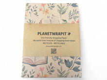 Load image into Gallery viewer, Eco-friendly wrapping paper with floral design and 'Planetwrapit' branding on a white background. | Hadley Green Home
