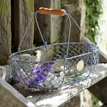 Load image into Gallery viewer, Wire basket with wooden handle holding flowers on a wooden surface | Burgon and Ball | Hadley Green Home
