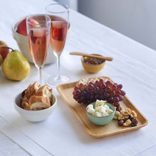 Load image into Gallery viewer, Table setting with champagne, fruit, and snacks on a white surface | Bambu | Little Twidlets
