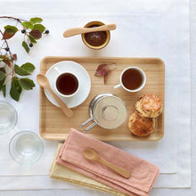 Load image into Gallery viewer, Wooden tray with tea cups, scones, and utensils on a white surface with leaves | Little Twidlets

