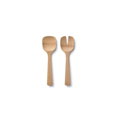 Two wooden bamboo salad serving spoons on a white background