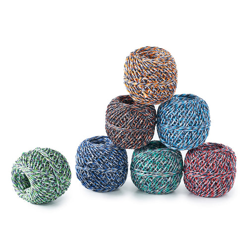 Colorful yarn balls stacked on a white background