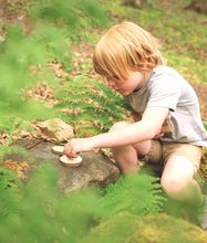 Load image into Gallery viewer, Child making a pizza kit for a bird in a forest setting | Hadley Green Home
