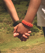 Load image into Gallery viewer, The Survival Bracelet Kit. two children holding hands each with a survival bracelet on. one in green and one in orange | Hadley Green Home

