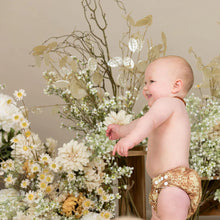 Load image into Gallery viewer, Baby in a little Lamb nappy standing among flowers and plants. | Hadley Green Home 
