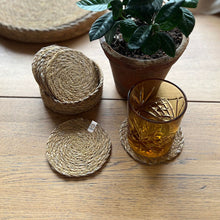 Load image into Gallery viewer, Set of round jute coasters on a wooden surface with a glass  and a potted plant. | Respiin | Hadley 
Green Home
