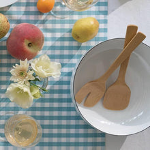 Load image into Gallery viewer, Table setting with wooden salad serving spoons, apples, lemons, and flowers on a checkered tablecloth | Little Twidlets 
