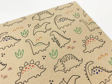 Load image into Gallery viewer, Kraft paper with dinosaur illustrations on a white background | Hadley Green Home
