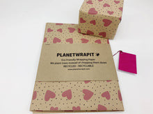 Load image into Gallery viewer, Eco-friendly wrapping paper with heart pattern and 'Planetwrapit' branding on a white background. | Hadley Green Home
