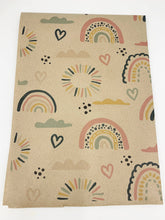 Load image into Gallery viewer, Kraft wrapping paper from Planet Wrap It with colourful rainbow and heart patterns on a white background | Hadley Green Home
