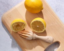 Load image into Gallery viewer, Wooden cutting board with lemons and a wooden juicer on a light background | Hadley Green Home
