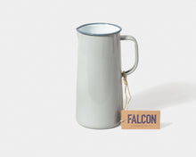 Load image into Gallery viewer, White ceramic pitcher with blue rim on a white background, featuring a &#39;FALCON&#39; tag. Hadley Green Home

