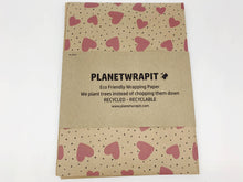 Load image into Gallery viewer, Eco-friendly wrapping paper with heart pattern and 'Planetwrapit' branding on a white background | Hadley Green Home
