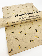 Load image into Gallery viewer, Eco-friendly wrapping paper with bee design and 'Planet Wraps' branding. | Hadley Green Home
