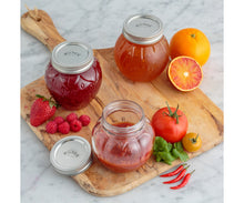 Load image into Gallery viewer, Kilner Jars of homemade jam on a wooden cutting board with fresh fruits and vegetables. | Hadley Green Home 
